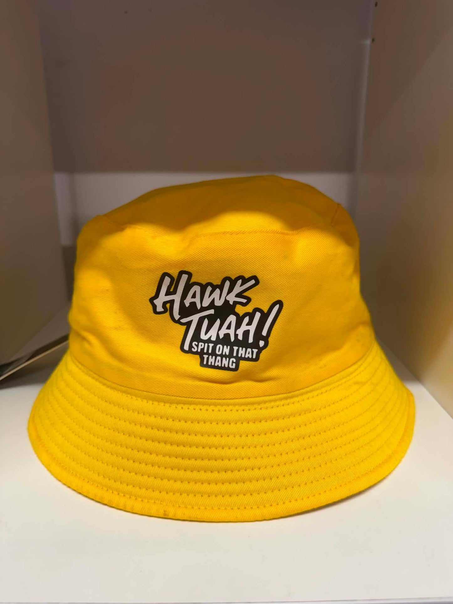 Hawk Tuah Spit on That Thang yellow bucket hat | Novelty hats Belfast