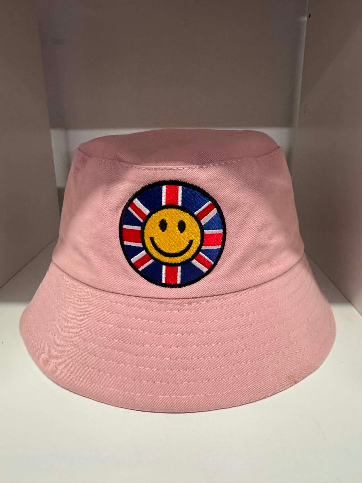 Pink Union Jack smiley face bucket hat | British festival hats Belfast