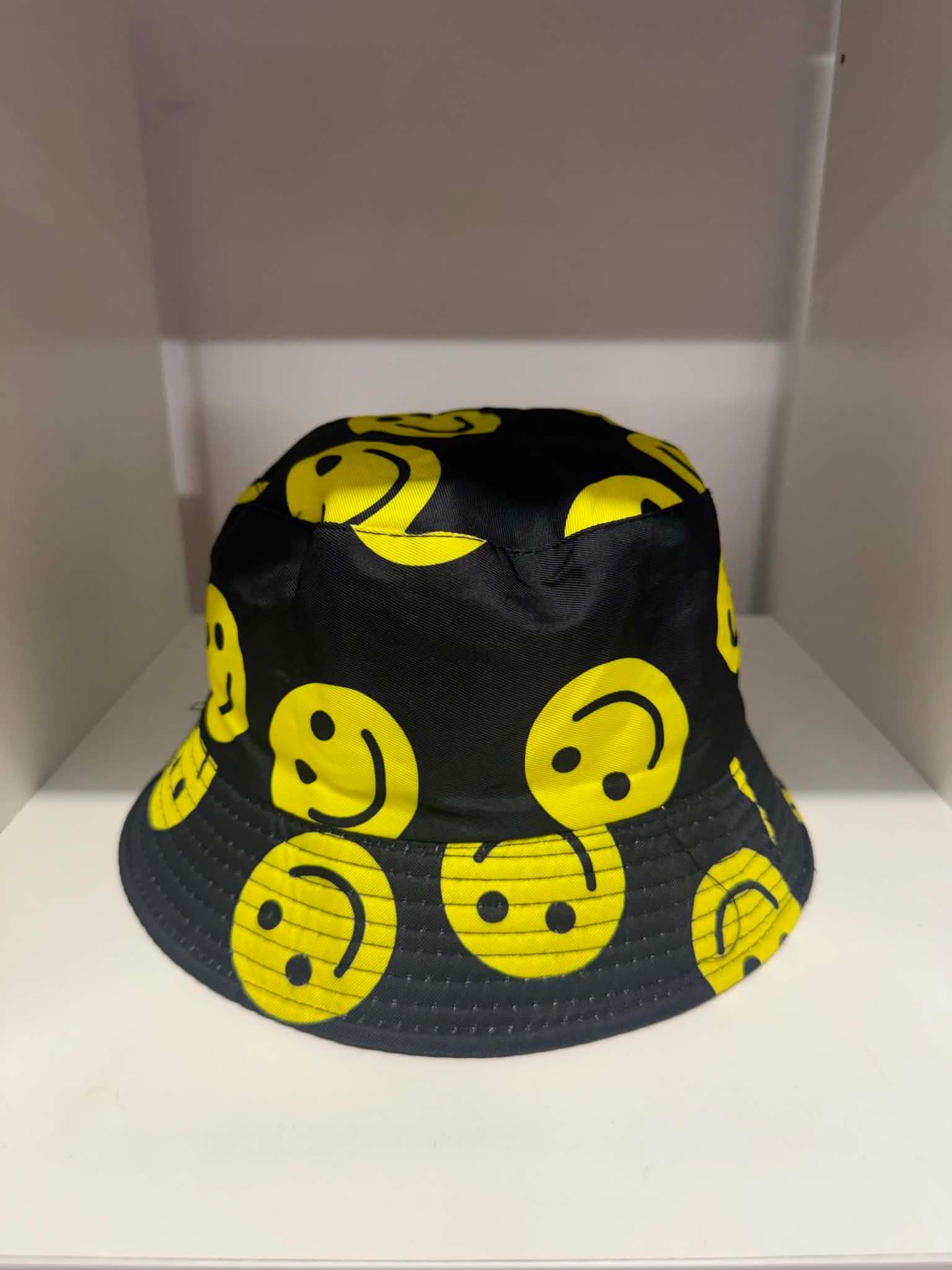 Black all-over yellow smiley face bucket hat | Festival hats Belfast NI