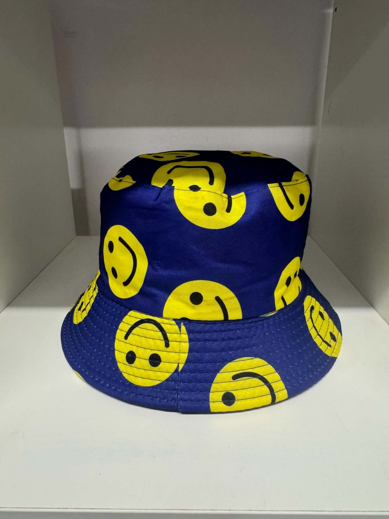 Blue all-over smiley face print bucket hat | Novelty hats Belfast NI