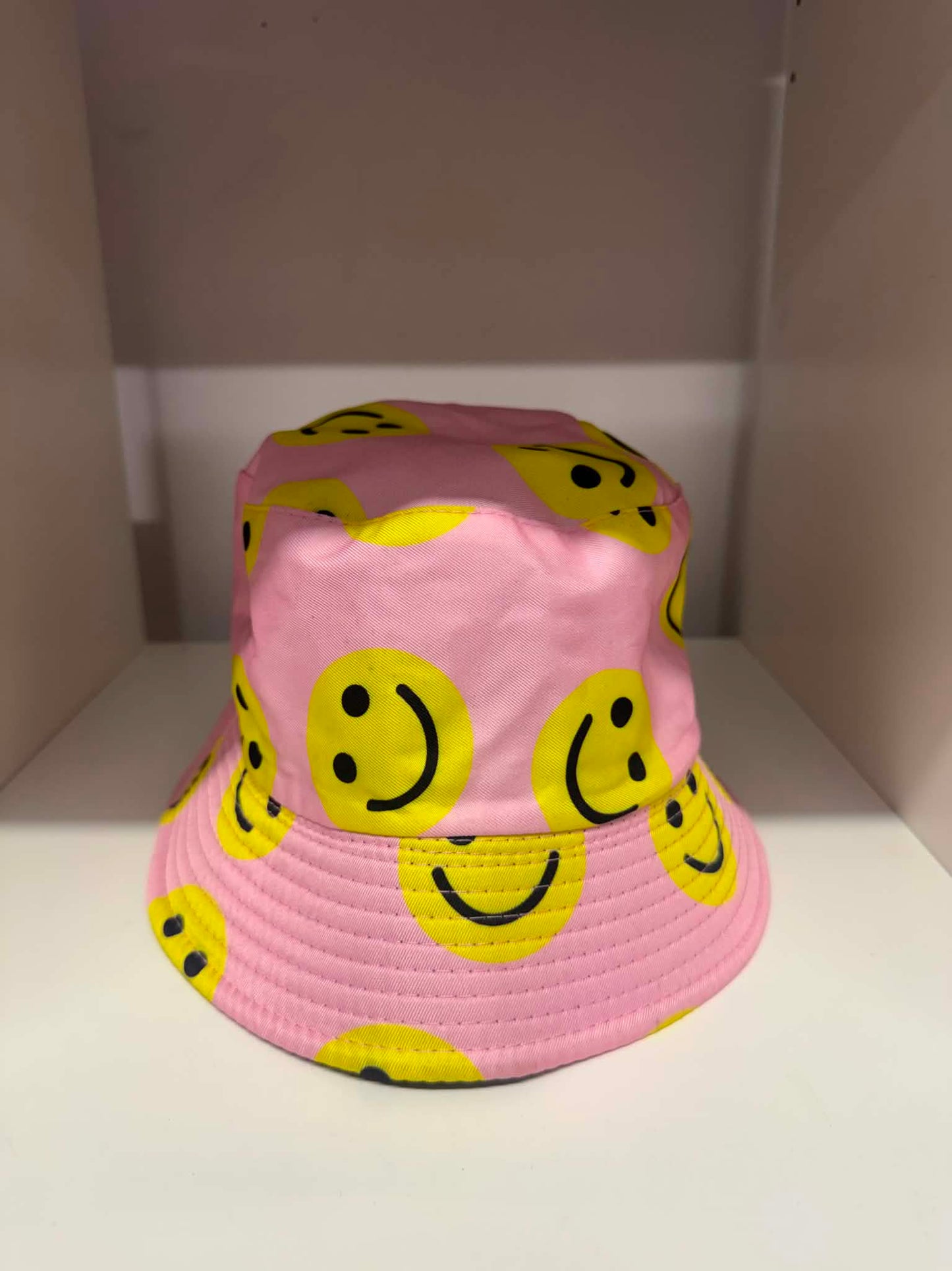 Pink all-over yellow smiley face bucket hat | Festival hats Belfast