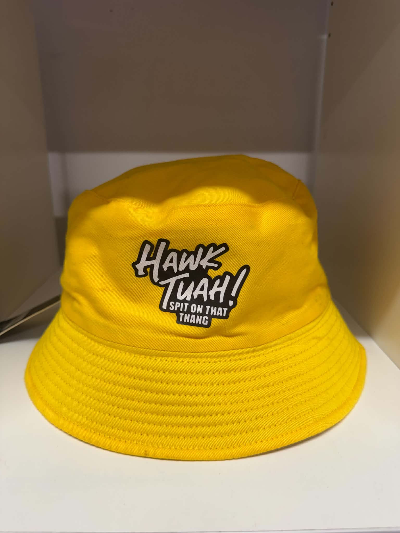 Hawk Tuah Spit on That Thang yellow bucket hat | Novelty hats Belfast