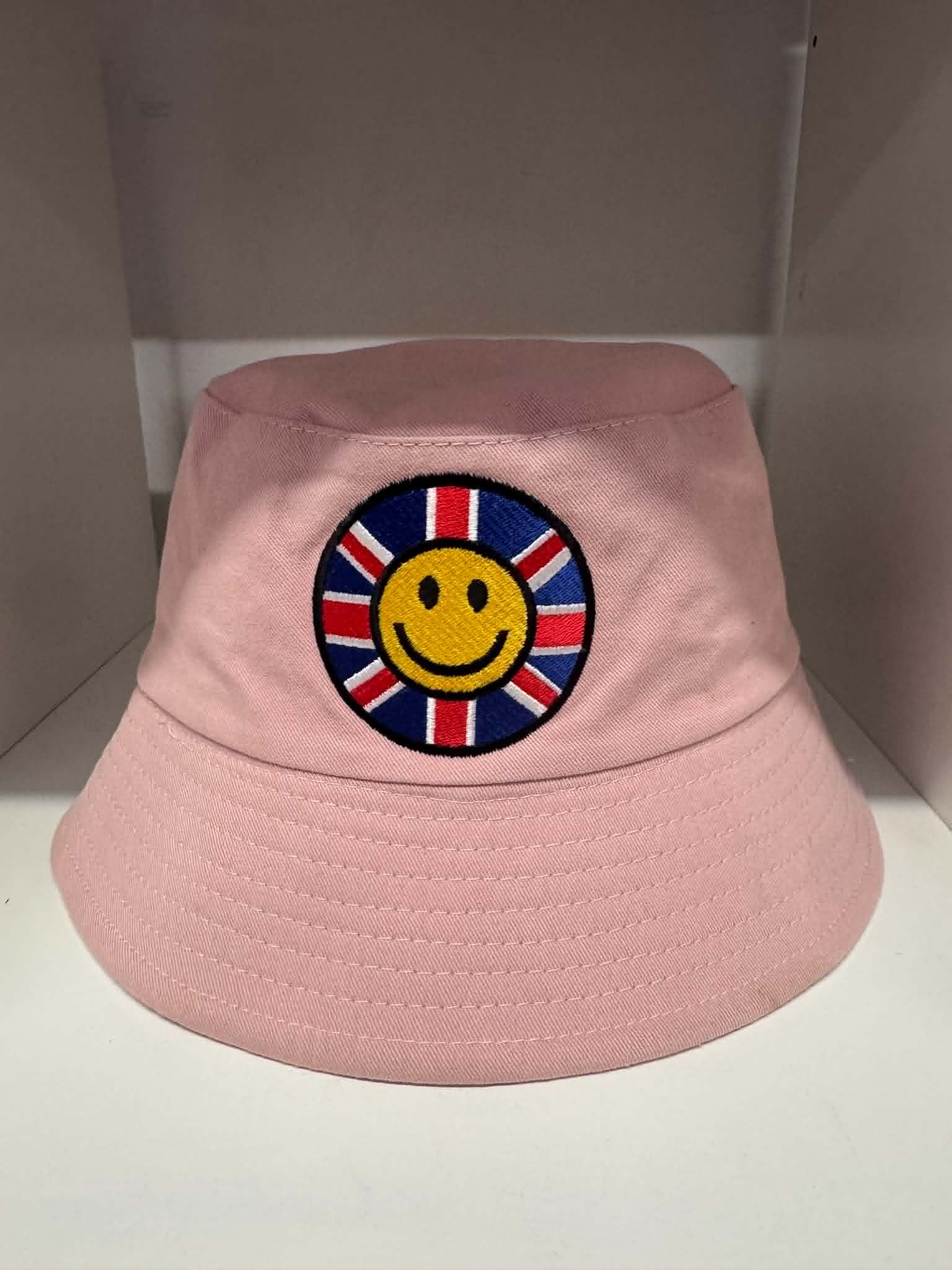 Pink Union Jack smiley face bucket hat | British festival hats Belfast